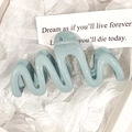 Glossy morandi light blue wavy claw clip for hair styling on a minimalist background - Blue