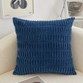 Navy blue corduroy square throw pillow on a modern cream sofa in a cozy home setting - Striped Deep Blue