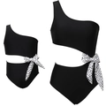 Detail of one-shoulder cutout swimsuit with polka dot bow accent in black - Adult S / Black Polka Dot