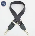 Detail of adjustable gray polyester shoulder strap with golden metal lobster clasps - Dark Grey Strap-Dark Grey Leather / Light Gold Buckle
