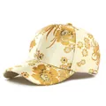 Beige baseball cap featuring premium gold floral embroidery and satin texture detail - Champagne Gold