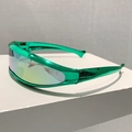 Side view of futuristic Y2K green metallic wraparound sports sunglasses on a white block - Electroplated Green Frame Orange Mirror Lens