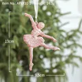 Pink glitter ballerina Christmas ornament hanging on a green tree, 13cm height - Pink Ballet Dancer