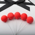 Five red clay balloon cake toppers with black ribbon bow on white background - Single Piece / Red Single Ball