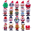 Set of 19 Christmas clockwork toys including Santa, penguin, and reindeer on white background - Christmas Series 20pcs Set A