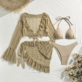 Flat lay of beige four-piece bikini set with sheer lace cover-up and ruffled skirt - Earthy Yellow