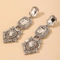 Detailed view of luxury geometric silver drop earrings with faceted clear crystals - 925 Silver Pin Geometric Long Style (HE4932) / Silver Crystal Drop Earrings