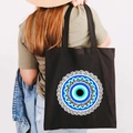 Black canvas tote bag featuring blue Greek Evil Eye graffiti print with wide shoulder strap - Design T-Mandala Eye-Black