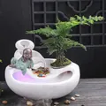 White ceramic flowing water fountain featuring a small monk figurine and mist effect - Carefree + Flowing Wealth - White Style