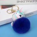 Navy blue faux rabbit fur pompom keychain with a white leather unicorn bag charm - Light Gold 4-Link Lobster Clasp / 8cm Sapphire Blue Unicorn