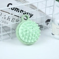 Light green silicone scalp massage brush with integrated ring handle for easy grip - Japanese Nordic Green