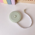 Mini cinta métrica verde claro con botón de retracción automática y cinta flexible de 1,5m - Verde