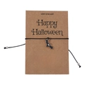 Close-up of Halloween wish bracelet with black bat charm on English greeting card - Bat Style