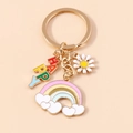 Golden heart keychain with rainbow cloud, white daisy flower and HAPPY charms - HAPPY Style