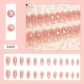 Detail view of pink starry press-on nails set with model R689 in various sizes - R689 Shining Stars