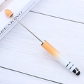 Orange and white gradient touch screen pen with stylus tip on white wooden desk - Gradient Orange