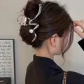 Silver wavy metal hair claw with white pearl bead accent worn on model hair - Lightning Wave Pearl Style / Large / Silver