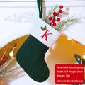 Dark green knitted Christmas stocking with white cuff and red letter K embroidery - Letter K / Dark Green