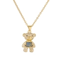 Golden teddy bear necklace with clear and blue crystals on a bright white background - Blue