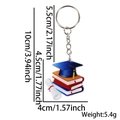 Acrylic graduation keychain with blue cap and stack of books on white background - Books & Graduation Hat Style