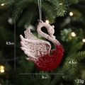 Dark red flocked swan Christmas ornament with silver glitter on festive tree branch - Swan