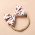 Close-up of floral bow baby headband with pink roses on soft nylon elastic band - Pink Yellow Rose Floral