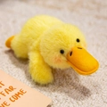 Plush capybara magnetic fridge magnet in lying yellow duck design with soft fluffy fur - Duck