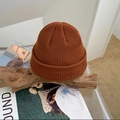 Close-up of caramel knitted beanie with detailed texture on rustic wooden branch - M (56-58cm) / Caramel color
