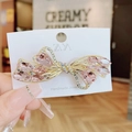Elegant pink crystal butterfly hair clip with gold alloy base on a display card - Butterfly Knot Pink Spring Clip
