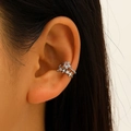 Minimalist silver ear cuff featuring star-shaped cubic zirconia on a female ear - Silver Pentagram Zircon Style (8411)