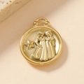 Macro shot of 18K gold stainless steel Gemini zodiac pendant with embossed relief art - Gemini