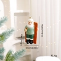 Skiing Santa Claus Christmas ornament in green and white with dimensions and weight info - Skiing Santa Green