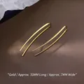 Minimalist long gold curved dangle earrings measuring 33mm length and 7mm width - Yellow Gold Color