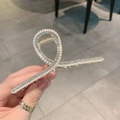 Detailed view of golden hair claw clip with inlaid pearls and sparkling rhinestones - Pearl Rhinestone Barrette