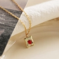 Retro gold square necklace with red enamel heart and embossed bear charm on white fabric - Square Bear Red Heart