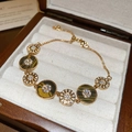 Detail of 18K gold plated bracelet with tiger eye stones and zircons in a velvet box - Round Tiger Eye Bracelet / Gold-Brown (Tiger Eye Style)