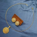 Detailed view of gold mesh pendant necklace and stud earrings set on blue silk - E6107-14/Gold Round Mesh Hollow