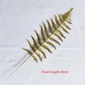 Detail view of 45cm artificial gold glitter fern branch for Christmas decoration - Hollow Persian Leaf