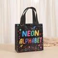 Detail of neon alphabet print on black non-woven waterproof gift bag with handle - NEON ALPHABET