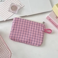 Detail of pink plaid fabric texture and white metal zipper on portable storage bag - Wrinkled Blue Pink Plaid