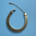 Close-up of gold stainless steel flat mesh chain bracelet with lobster clasp and extender - Gold Bracelet 8mm