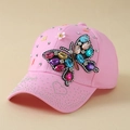 Pink women's baseball cap featuring a large colorful rhinestone butterfly design - Pink