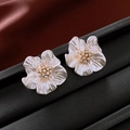 Close-up of pearl flower earrings with gold center and zircon detailing on a black stand - 6# White Pearly 5-Petal Flower