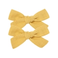 Set of two yellow linen cotton bow hair clips with textured fabric on white background - Bow Hair Clips Set / Yellow
