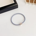 Blue elastic hair tie with a sparkling rhinestone-embedded metal square charm - Blue