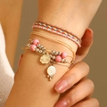 Bohemian woven friendship bracelet with cloud and lollipop charms on a model wrist - Cloud Lollipop Style (6518)