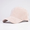 Close-up of fine corduroy texture and curved brim on a light pink baseball cap - Adjustable / Beige