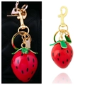 Red strawberry metal keychain charm with green leaves and golden ring for bags - BG00074 Red Strawberry Bag Pendant (Scene)