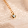 Detail of pink heart opal pendant on a delicate gold chain over silk background - Heart Blue Opal (Gold)
