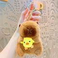 Cute brown capybara plush keychain with small yellow chicken charm and golden clasp - Costume Capybara-Chicken